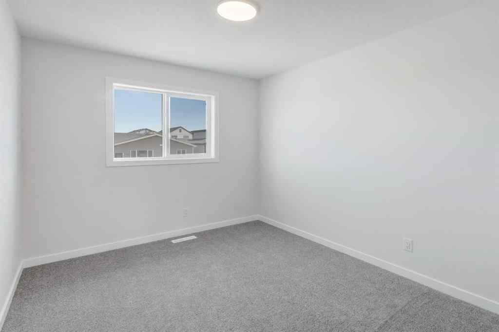 MLS® A2237065 - 909 Livingston View NE in Livingston Calgary, Residential