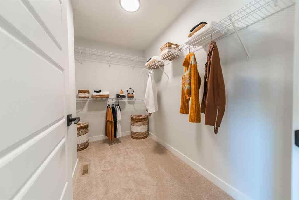 MLS® A2237133 - 405 Sora Way SE in Hotchkiss Calgary, Residential