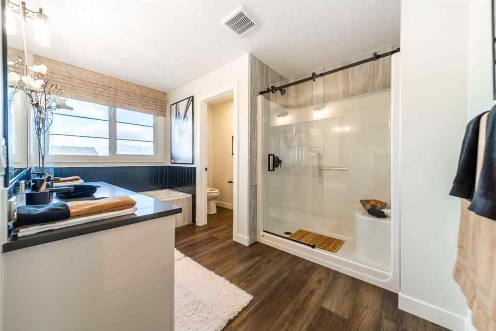 MLS® A2237133 - 405 Sora Way SE in Hotchkiss Calgary, Residential