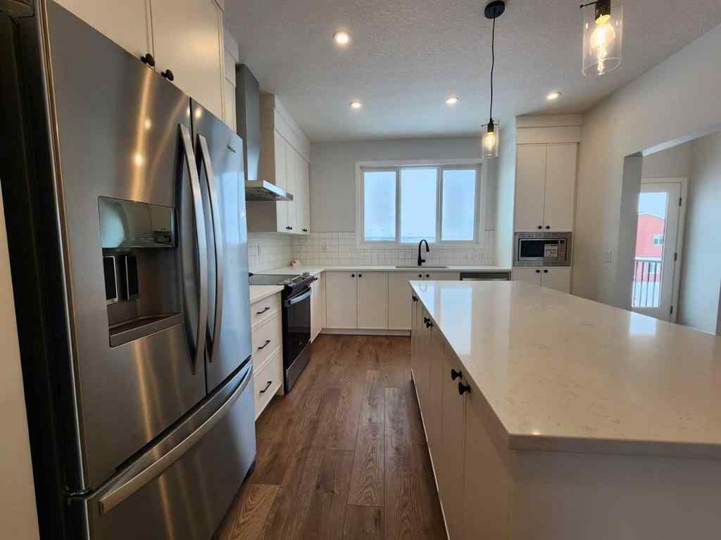 MLS® A2237555 - 575 Lucas Boulevard NW in Livingston Calgary, Residential
