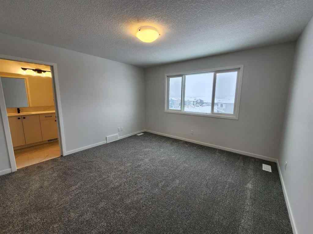 MLS® A2237555 - 575 Lucas Boulevard NW in Livingston Calgary, Residential
