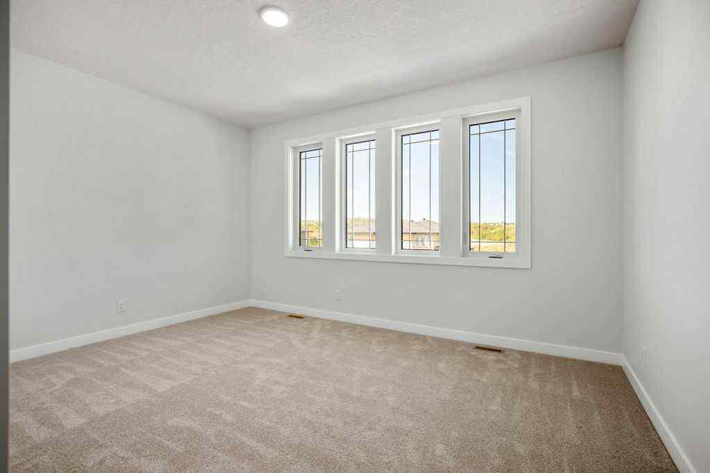 MLS® A2237918 - 229 Creekstone Hill SW in Pine Creek Calgary, Residential