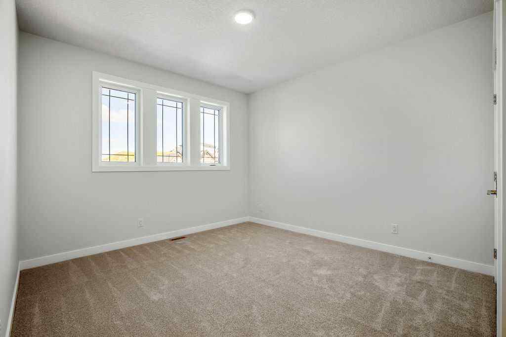 MLS® A2237918 - 229 Creekstone Hill SW in Pine Creek Calgary, Residential