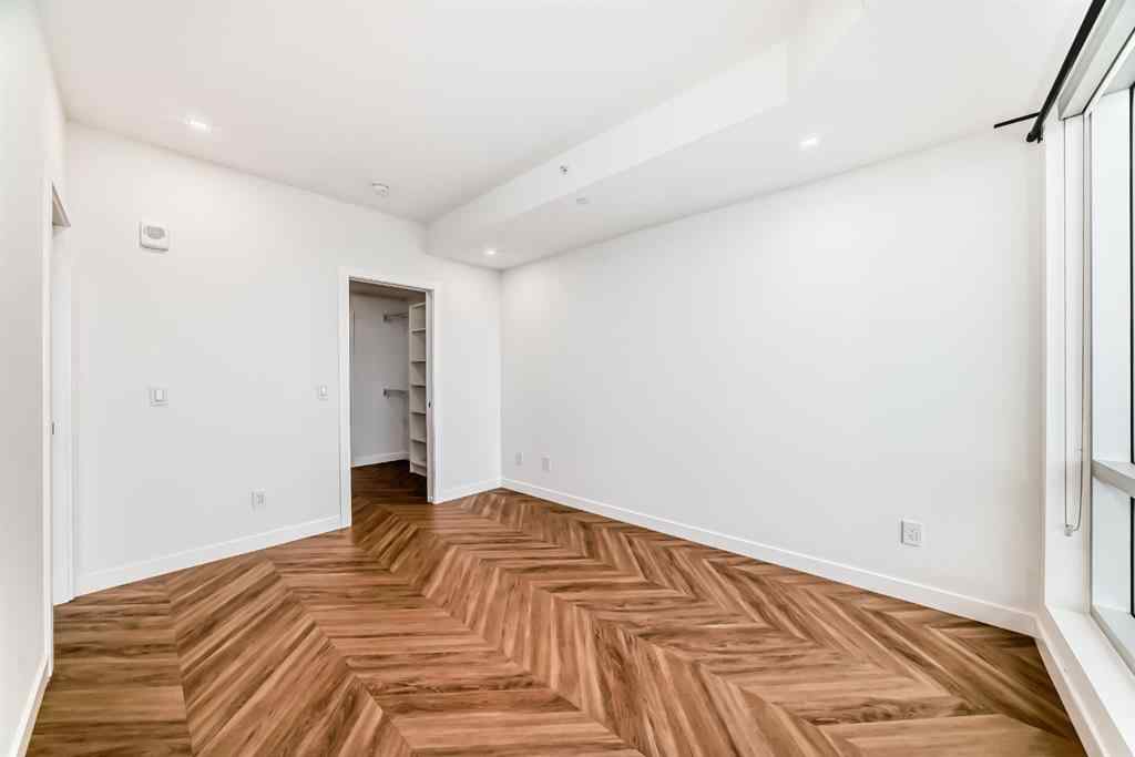 MLS® A2238449 - Unit #413 8445 Broadcast Avenue SW in West Springs Calgary, Residential