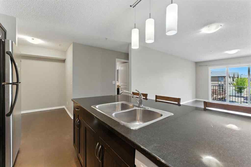 MLS® A2238552 - Unit #206 250 New Brighton Villas SE in New Brighton Calgary, Residential