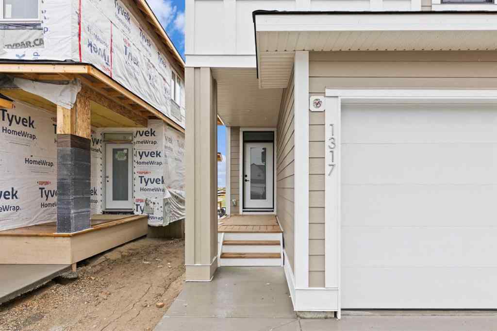 MLS® A2239089 - 1317 South Point Parade SW in South Point Airdrie, Residential
