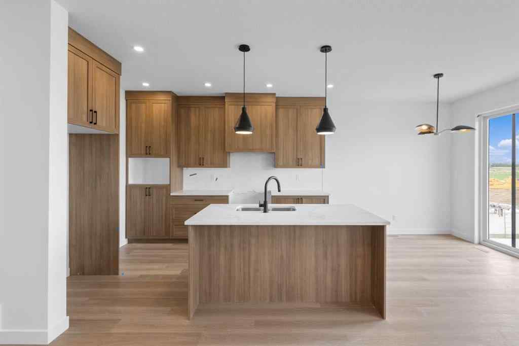 MLS® A2239089 - 1317 South Point Parade SW in South Point Airdrie, Residential