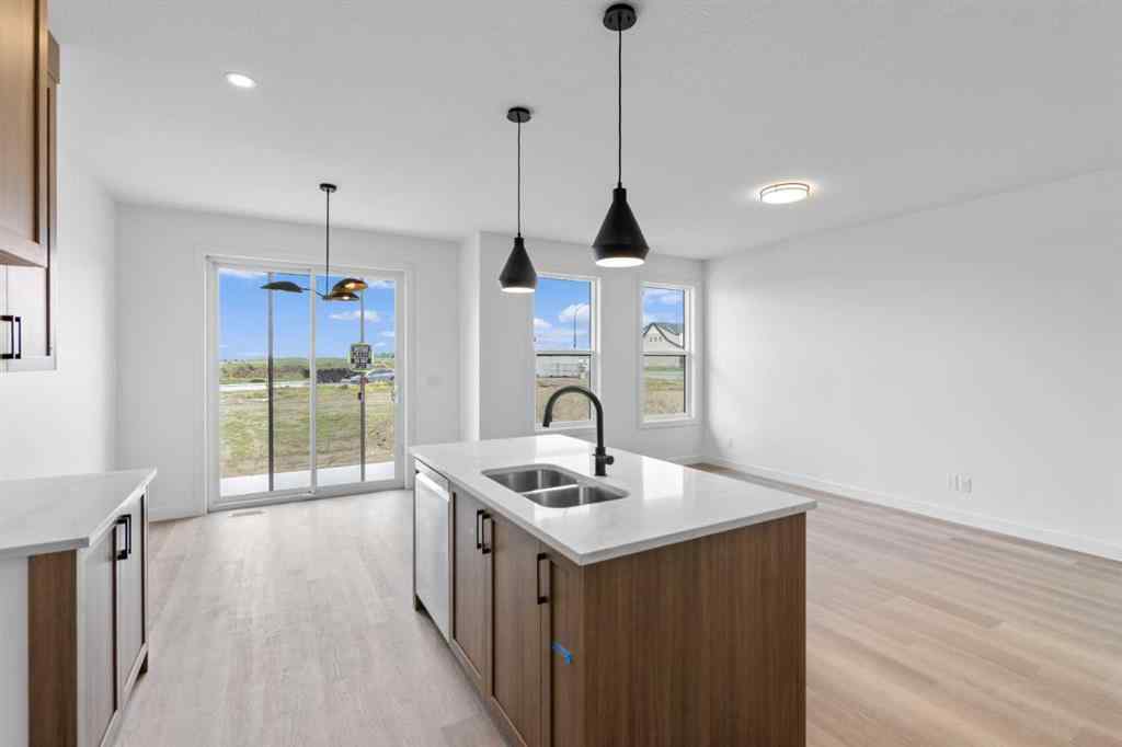 MLS® A2239089 - 1317 South Point Parade SW in South Point Airdrie, Residential