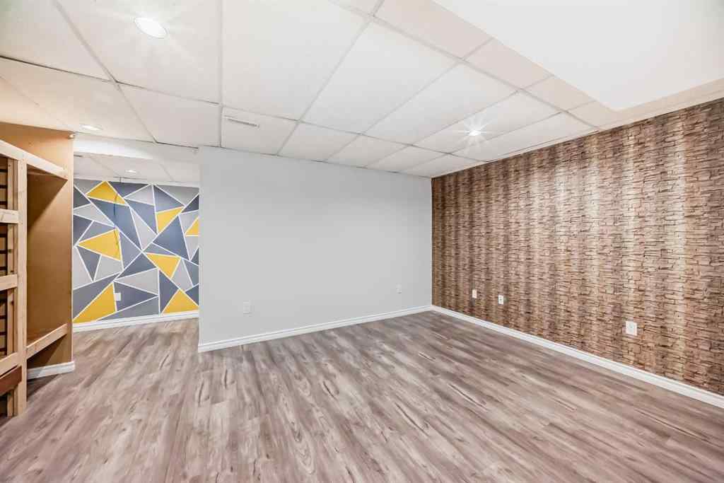 MLS® A2239315 - Unit #100 6103 Madigan Drive NE in Marlborough Park Calgary, Residential