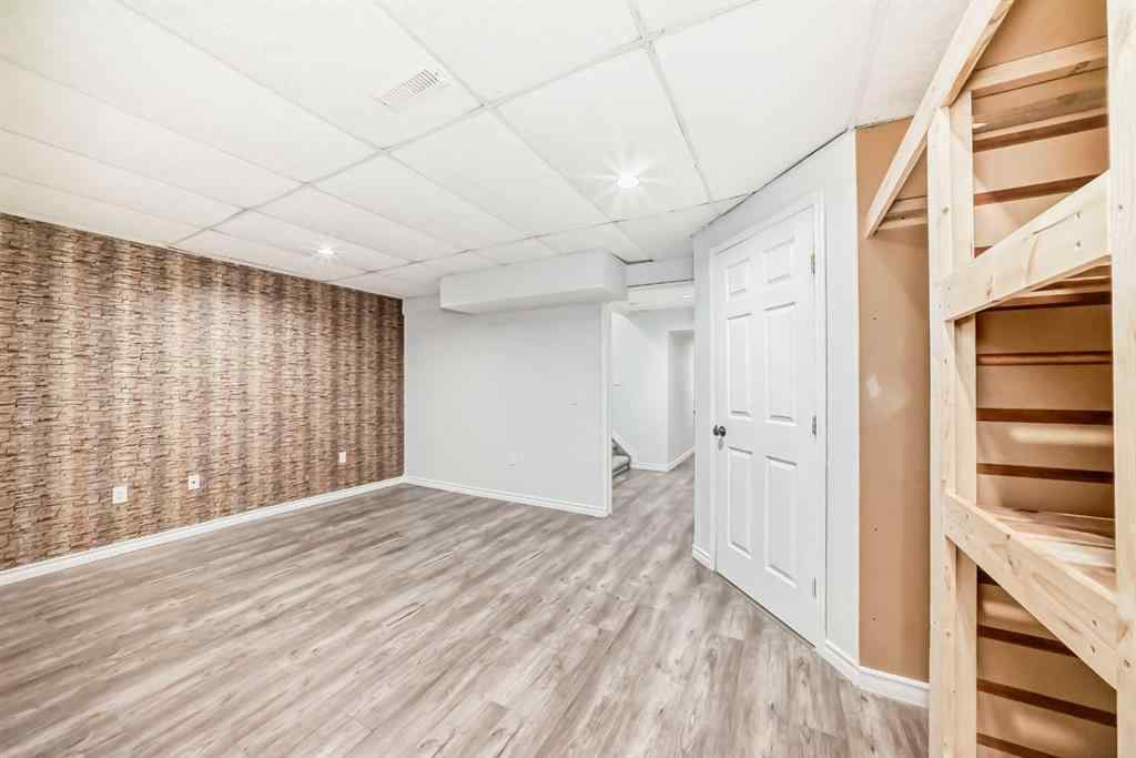 MLS® A2239315 - Unit #100 6103 Madigan Drive NE in Marlborough Park Calgary, Residential