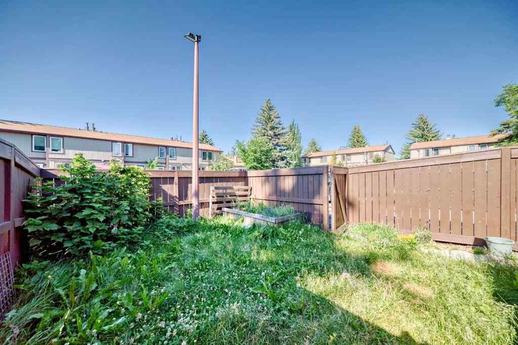 MLS® A2239315 - Unit #100 6103 Madigan Drive NE in Marlborough Park Calgary, Residential