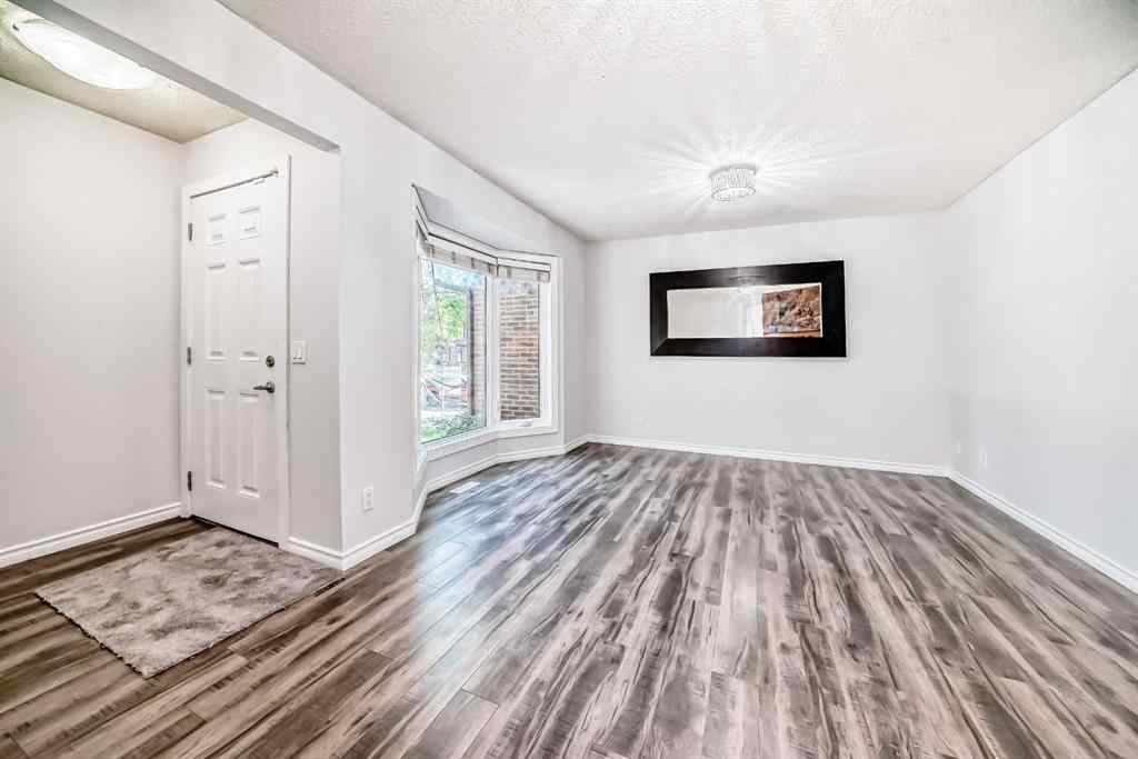MLS® A2239315 - Unit #100 6103 Madigan Drive NE in Marlborough Park Calgary, Residential