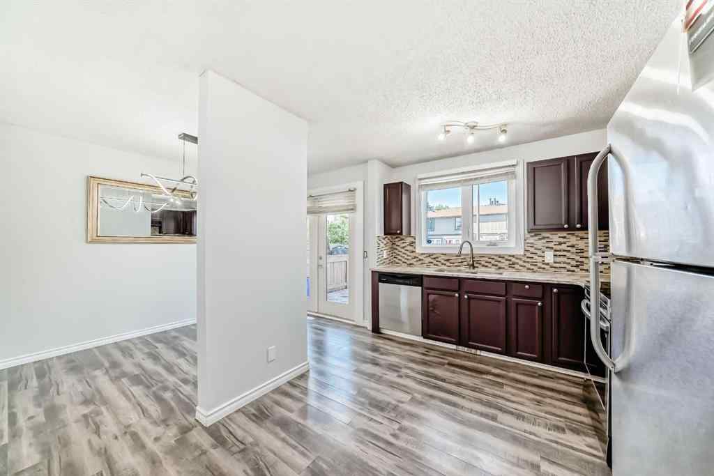 MLS® A2239315 - Unit #100 6103 Madigan Drive NE in Marlborough Park Calgary, Residential