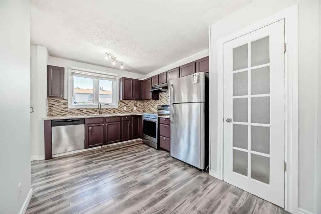MLS® A2239315 - Unit #100 6103 Madigan Drive NE in Marlborough Park Calgary, Residential