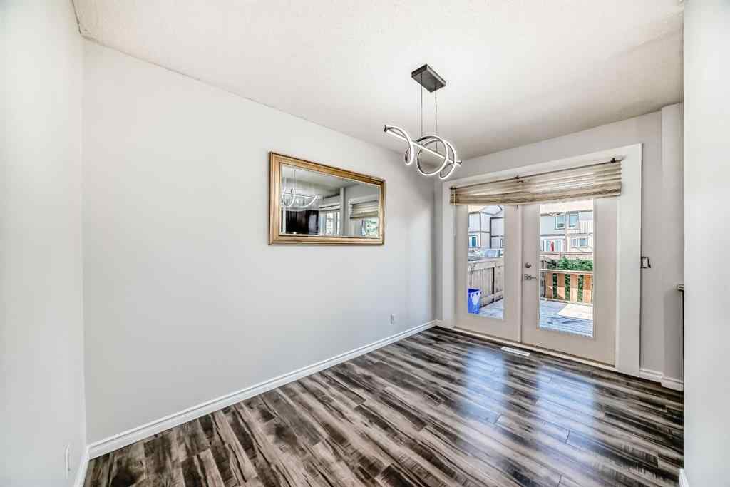 MLS® A2239315 - Unit #100 6103 Madigan Drive NE in Marlborough Park Calgary, Residential