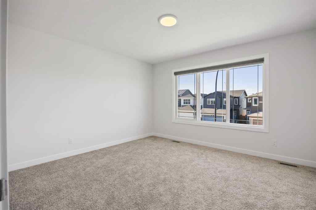 MLS® A2239472 - 105 Creekstone Path SW in Pine Creek Calgary, Residential