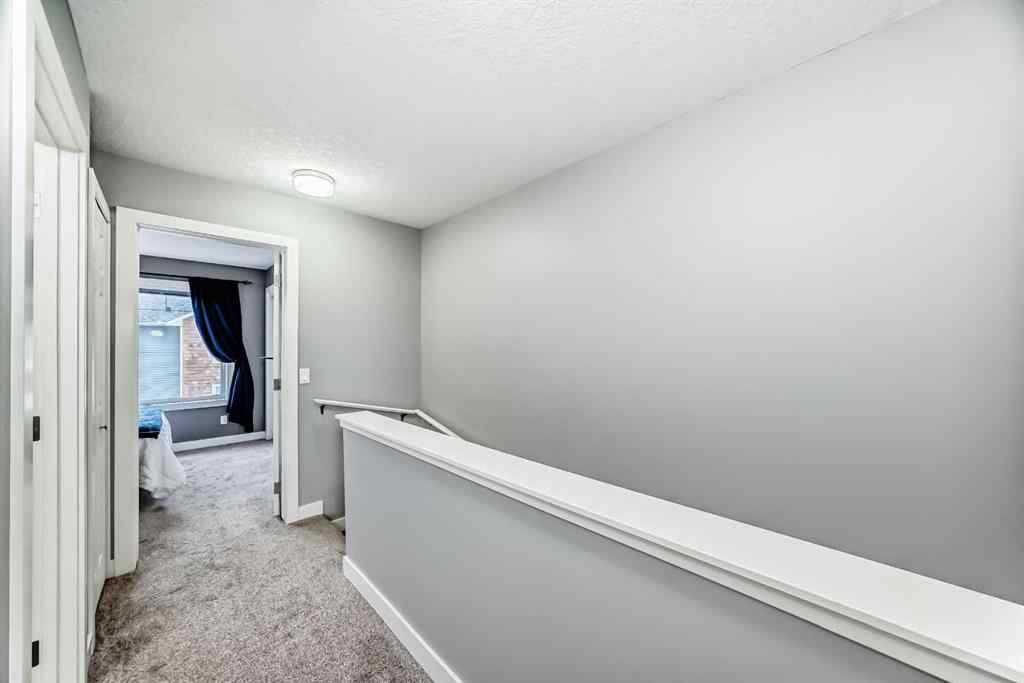 MLS® A2239508 - Unit #127 2802 Kings Heights Gate SE in Ravenswood Airdrie, Residential