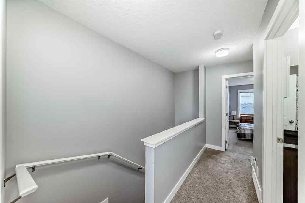 MLS® A2239508 - Unit #127 2802 Kings Heights Gate SE in Ravenswood Airdrie, Residential