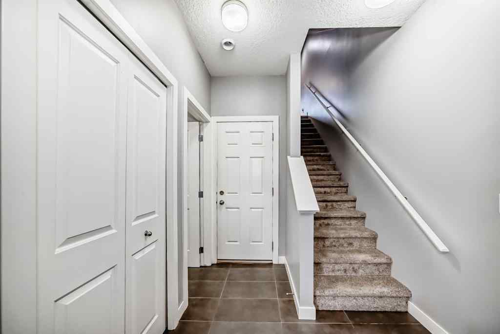 MLS® A2239508 - Unit #127 2802 Kings Heights Gate SE in Ravenswood Airdrie, Residential