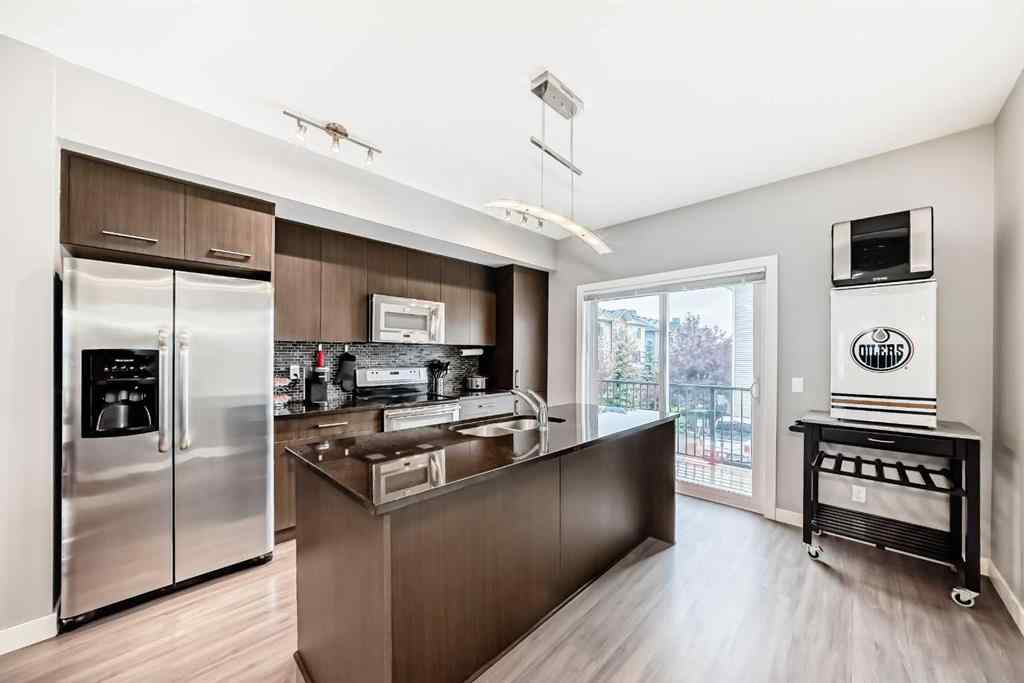 MLS® A2239508 - Unit #127 2802 Kings Heights Gate SE in Ravenswood Airdrie, Residential