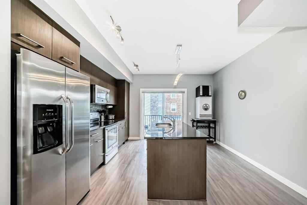 MLS® A2239508 - Unit #127 2802 Kings Heights Gate SE in Ravenswood Airdrie, Residential