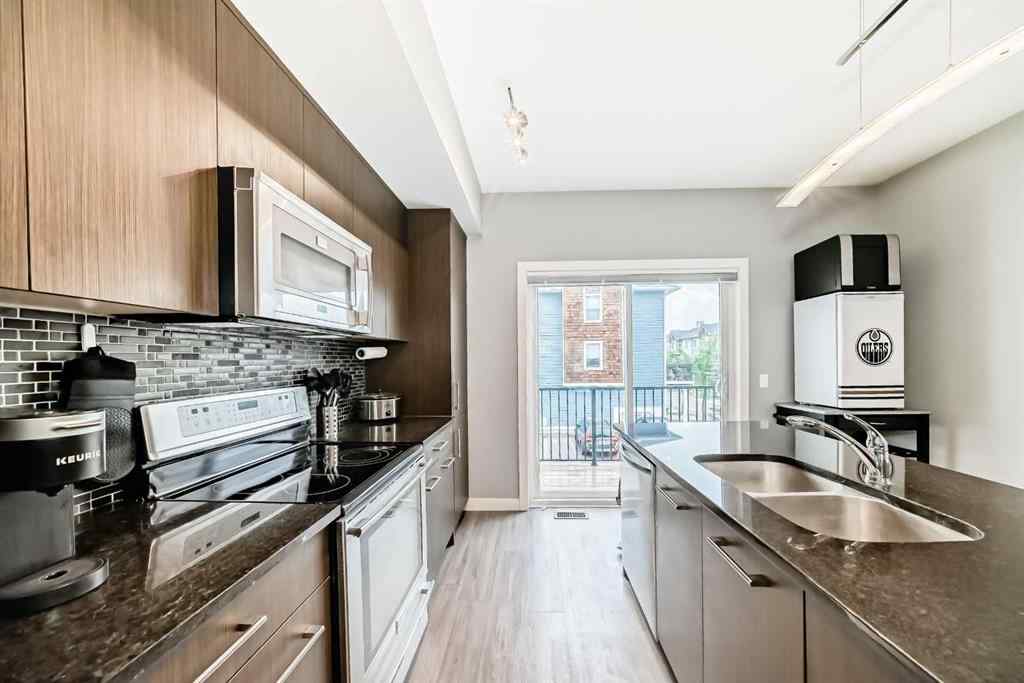 MLS® A2239508 - Unit #127 2802 Kings Heights Gate SE in Ravenswood Airdrie, Residential