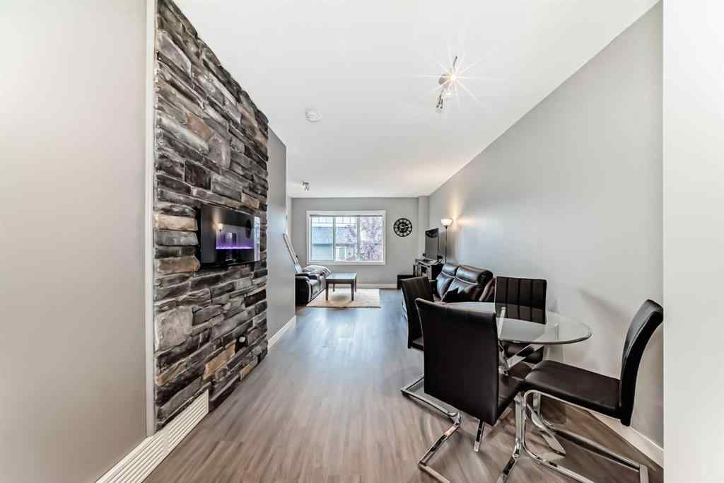 MLS® A2239508 - Unit #127 2802 Kings Heights Gate SE in Ravenswood Airdrie, Residential