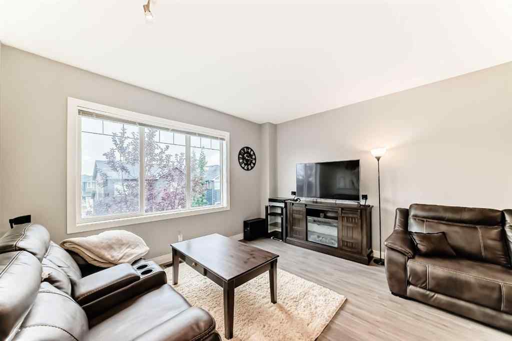 MLS® A2239508 - Unit #127 2802 Kings Heights Gate SE in Ravenswood Airdrie, Residential