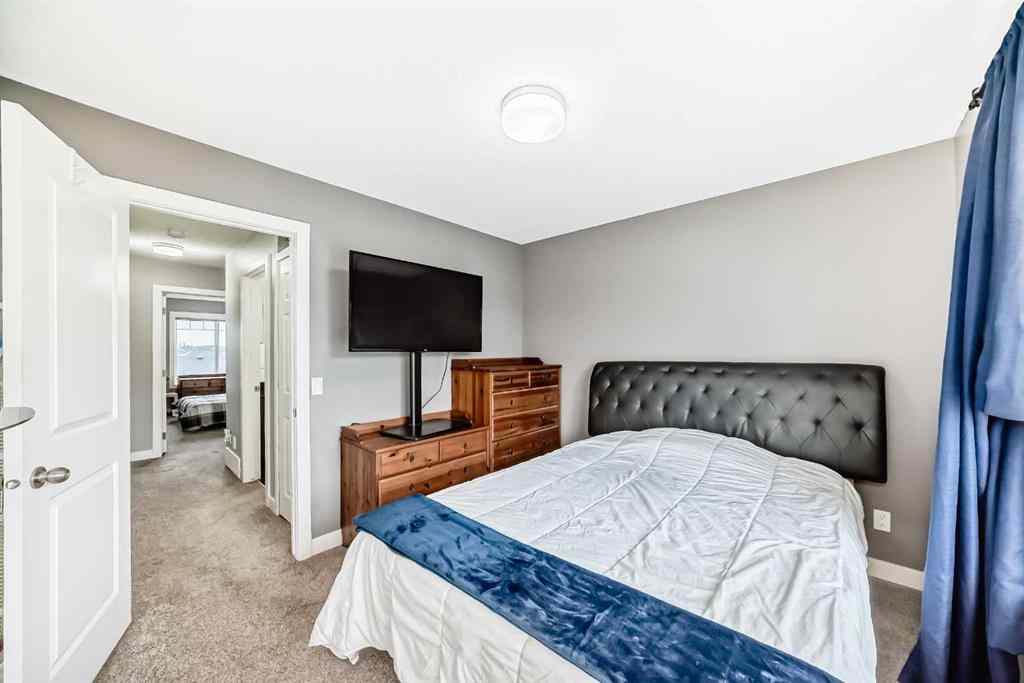 MLS® A2239508 - Unit #127 2802 Kings Heights Gate SE in Ravenswood Airdrie, Residential