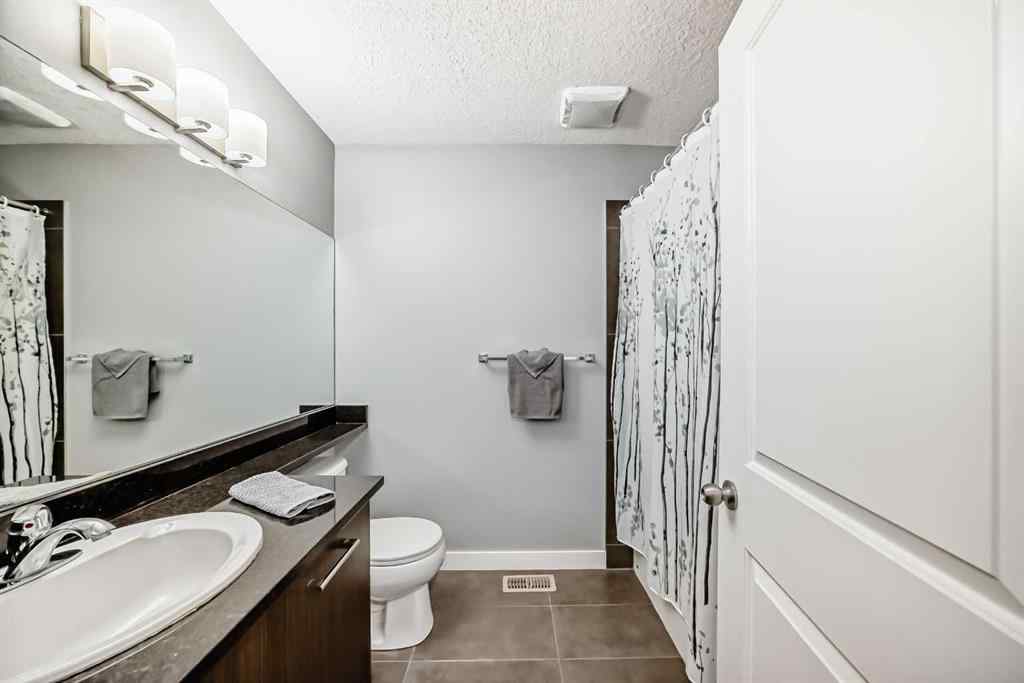 MLS® A2239508 - Unit #127 2802 Kings Heights Gate SE in Ravenswood Airdrie, Residential