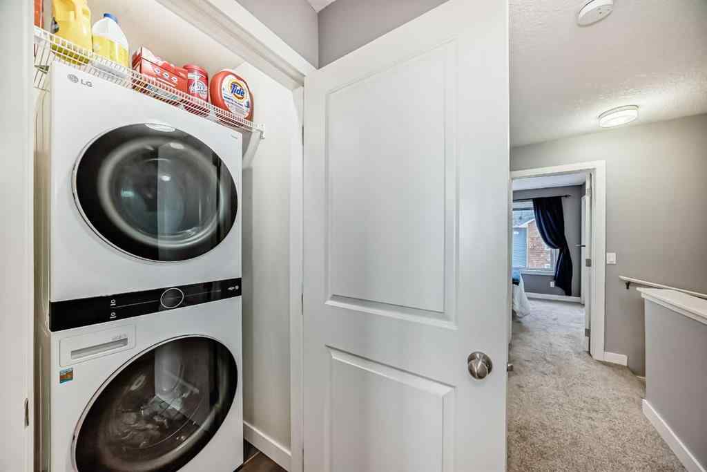 MLS® A2239508 - Unit #127 2802 Kings Heights Gate SE in Ravenswood Airdrie, Residential