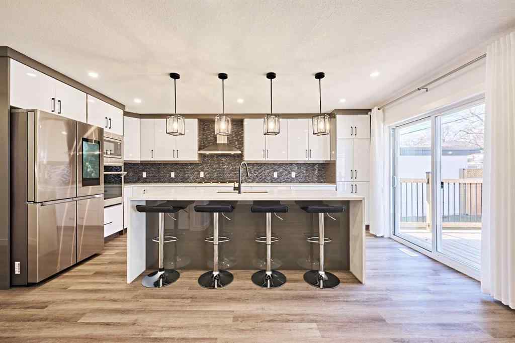 MLS® A2239567 - 77 Hartford Road NW in Highwood Calgary, Residential