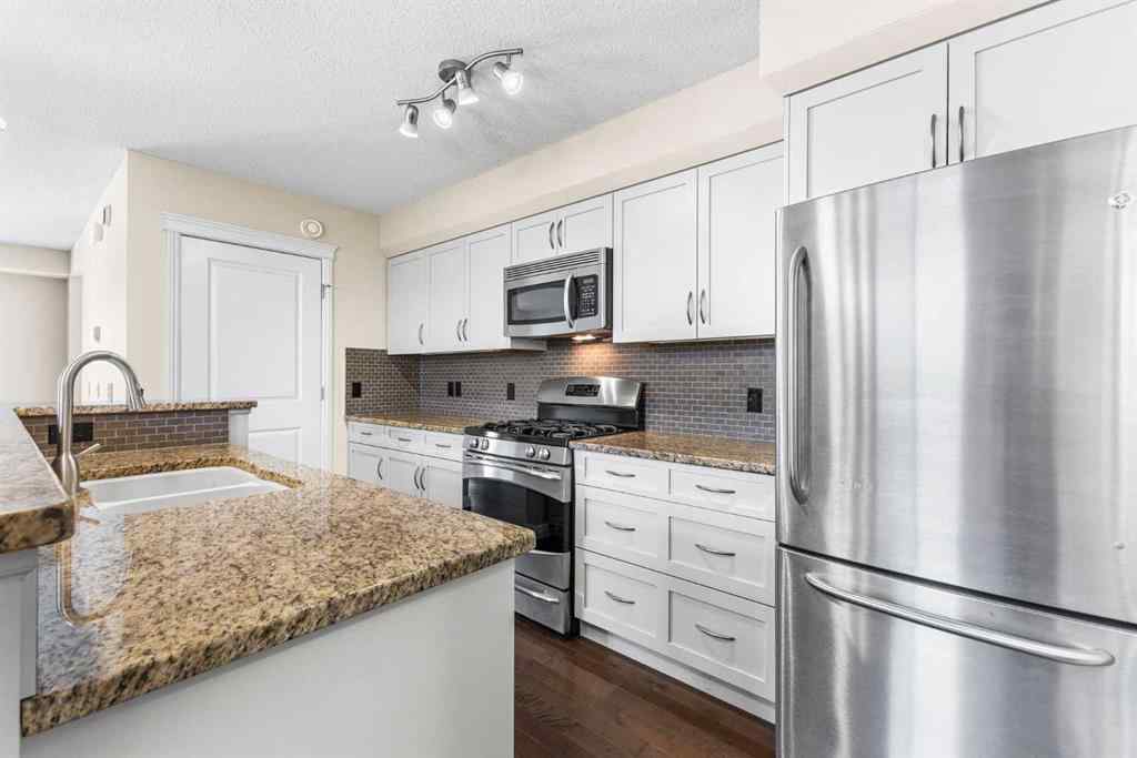 MLS® A2239675 - 50 Mike Ralph Way SW in Garrison Green Calgary, Residential