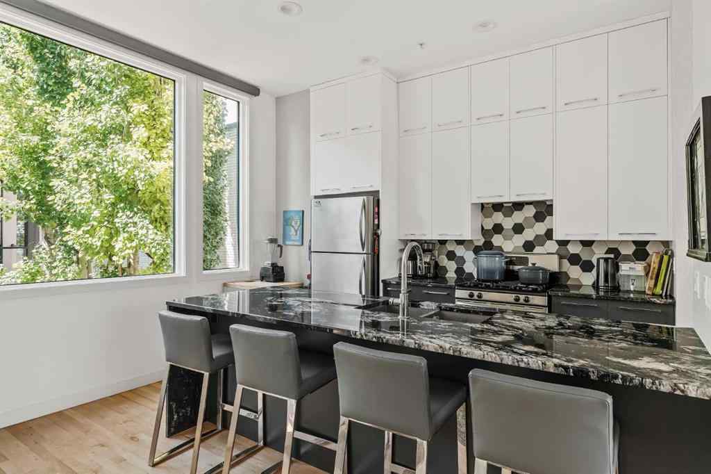 MLS® A2239808 - Unit #105 1720 12 Street SW in Lower Mount Royal Calgary, Residential