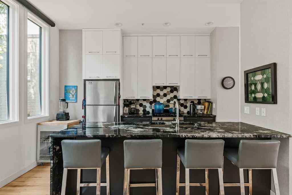 MLS® A2239808 - Unit #105 1720 12 Street SW in Lower Mount Royal Calgary, Residential
