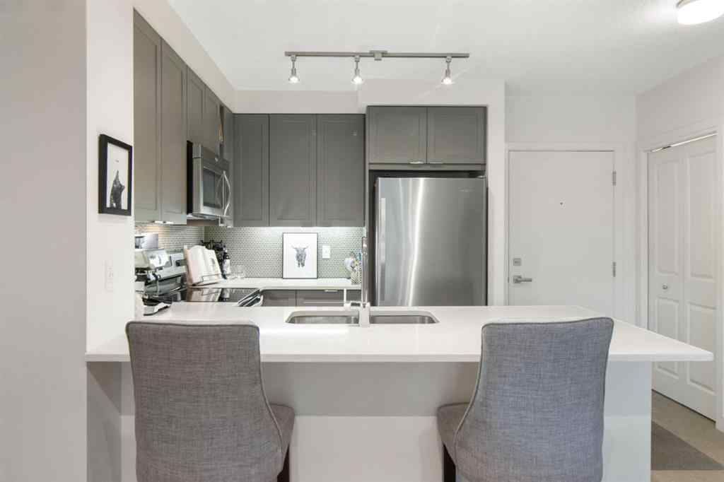 MLS® A2239976 - Unit #128 25 Auburn Meadows Avenue SE in Auburn Bay Calgary, Residential