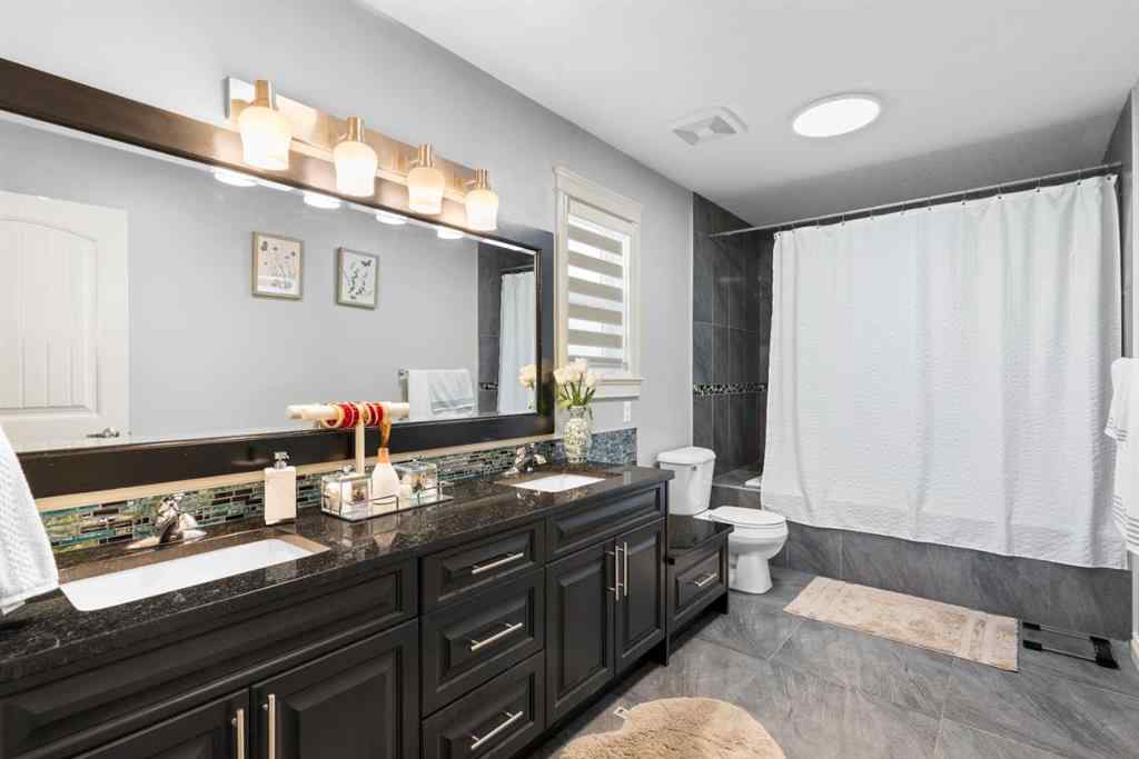 MLS® A2240092 - 409 Kinniburgh Boulevard  in Kinniburgh North Chestermere, Residential