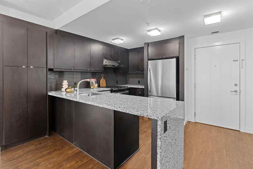 MLS® A2240203 - Unit #104 25 Aspenmont Heights SW in Aspen Woods Calgary, Residential