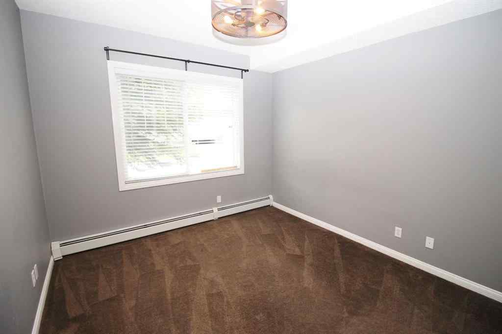 MLS® A2240286 - Unit #106 8 Prestwick Pond Terrace SE in McKenzie Towne Calgary, Residential