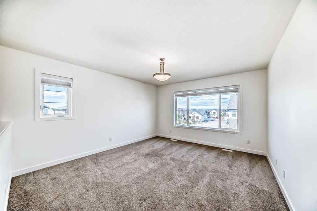 MLS® A2240430 - 99 Lawrence Green SE in Lanark Airdrie, Residential