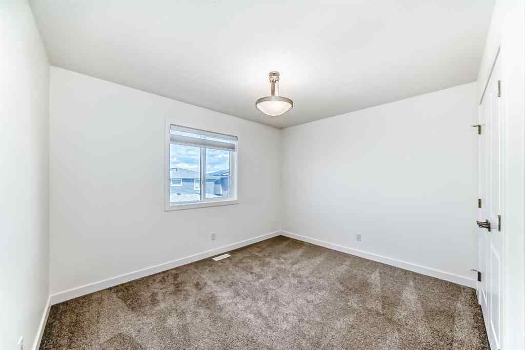 MLS® A2240430 - 99 Lawrence Green SE in Lanark Airdrie, Residential