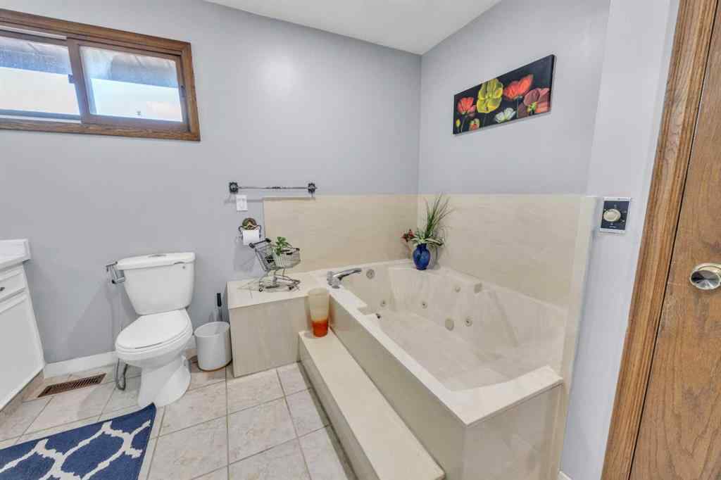 MLS® A2240643 - 303 Ranchridge Bay NW in Ranchlands Calgary, Residential