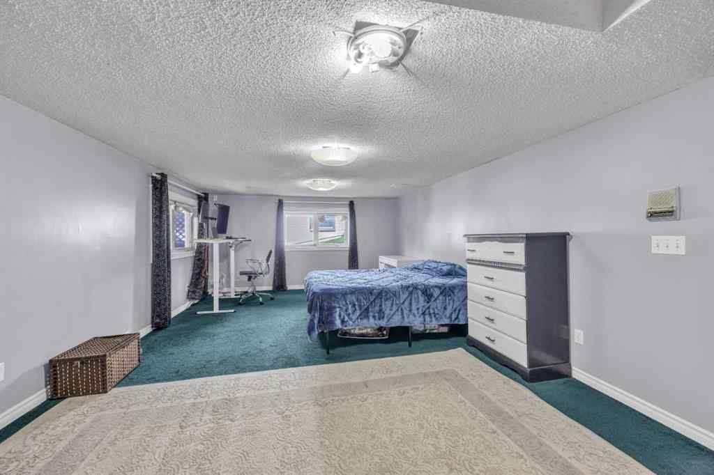 MLS® A2240643 - 303 Ranchridge Bay NW in Ranchlands Calgary, Residential