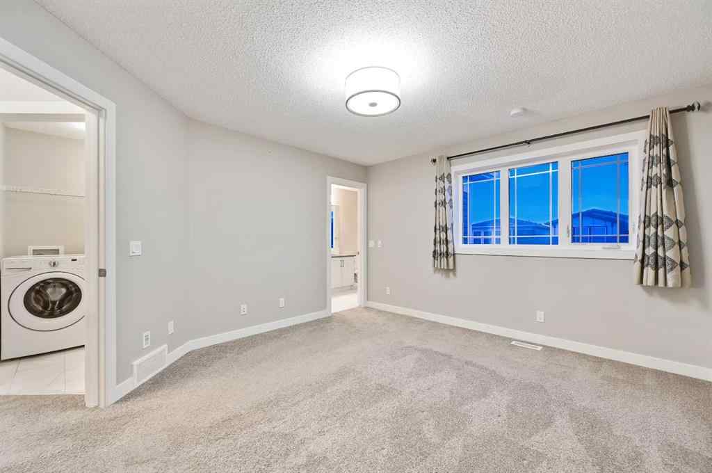 MLS® A2240761 - 26 Howse Row NE in Livingston Calgary, Residential