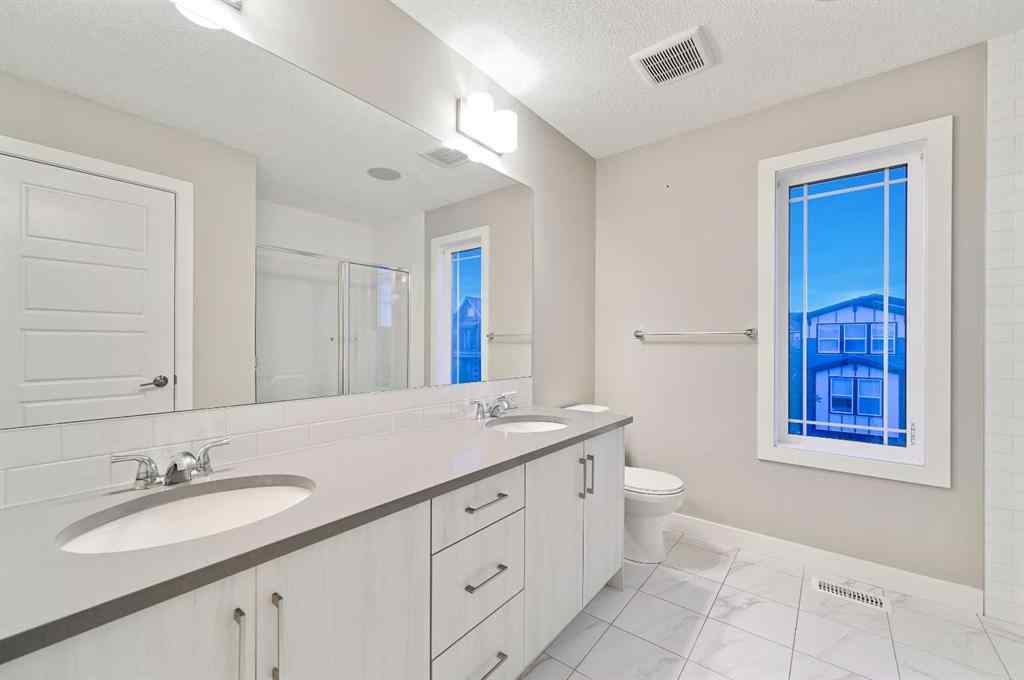 MLS® A2240761 - 26 Howse Row NE in Livingston Calgary, Residential