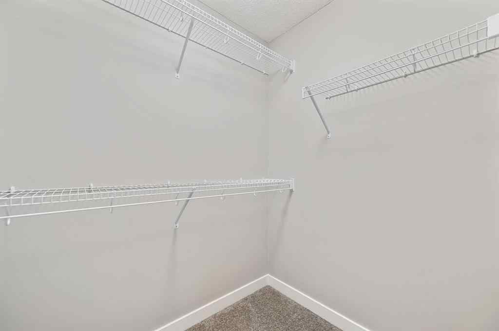 MLS® A2240761 - 26 Howse Row NE in Livingston Calgary, Residential