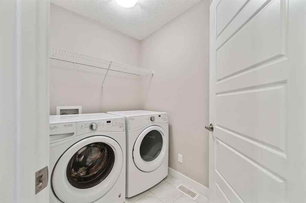 MLS® A2240761 - 26 Howse Row NE in Livingston Calgary, Residential