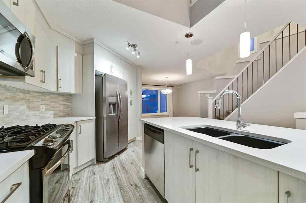 MLS® A2240761 - 26 Howse Row NE in Livingston Calgary, Residential