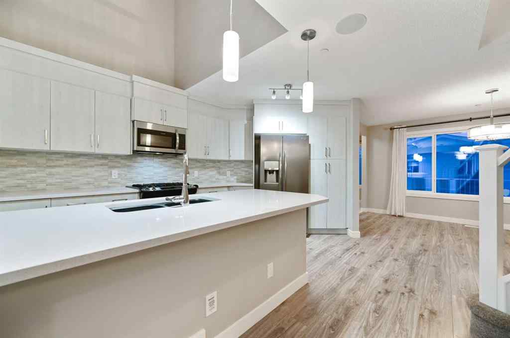 MLS® A2240761 - 26 Howse Row NE in Livingston Calgary, Residential