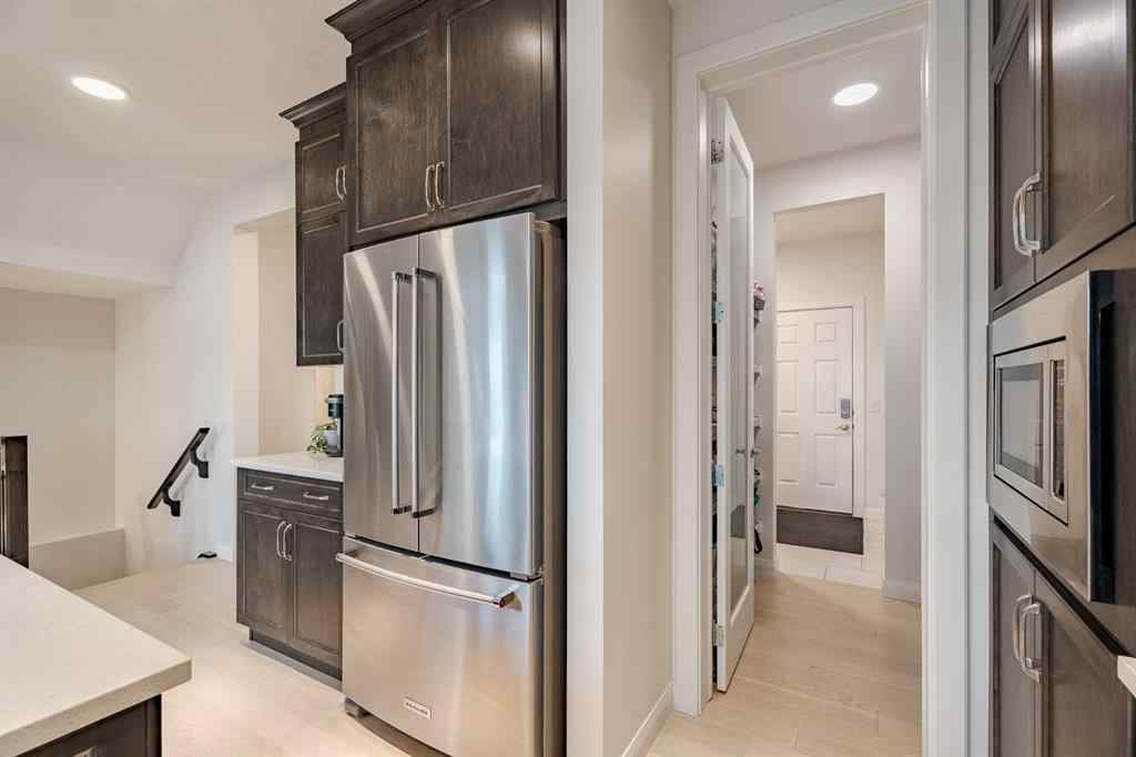 MLS® A2240957 - 2148 Ravensdun Crescent SE in Ravenswood Airdrie, Residential